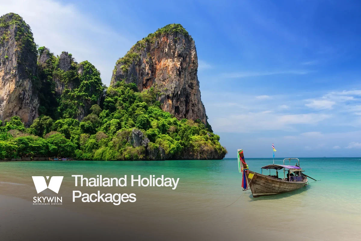 Tropical beach view with turquoise waters and traditional longtail boat in Krabi, Thailand